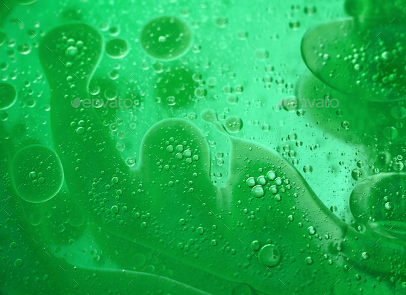 abstract green background formed by oil drops on water Stock Photo by ...