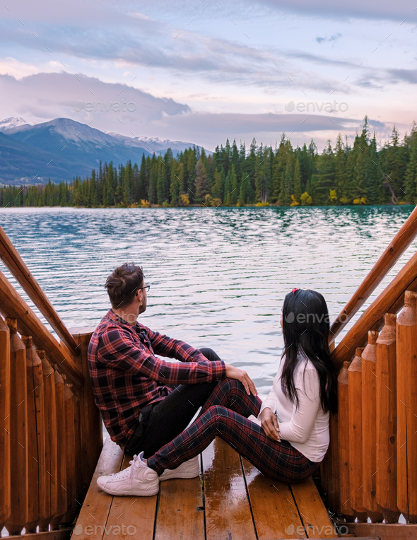 couple at beauvert lake, sunrise by lake at Jasper , Lac Beauvert Alberta Canadian Rockies Canada
