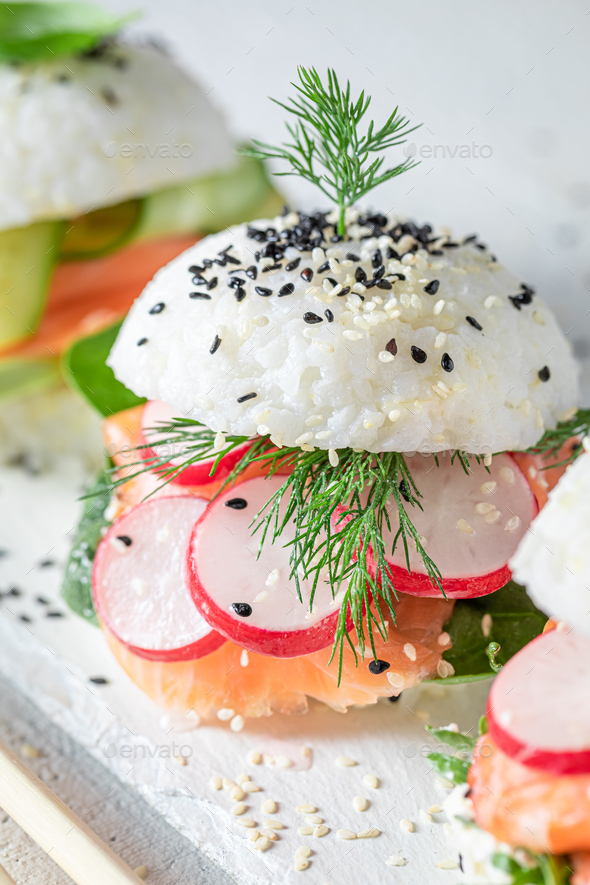 Delicious sushi burger with avocado and salmon as Japanese appetizers