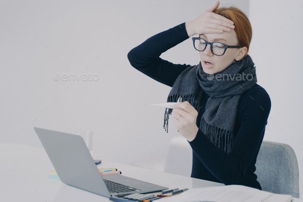 Sick manager at online conference. Unwell girl is shocked with her temperature and fever.