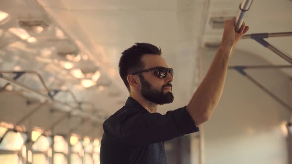 Man Passenger Holding Handrail On Train Or Electric Train. Male Hand With Watch Taken Handrail. alt