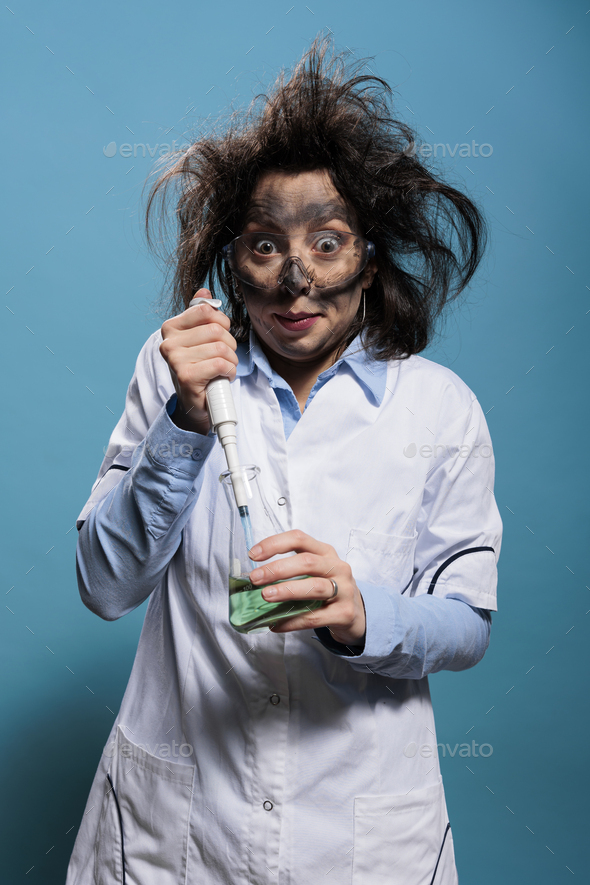 Wacky chemist with pipette and chemistry flask mixing chemical compounds to create experimental