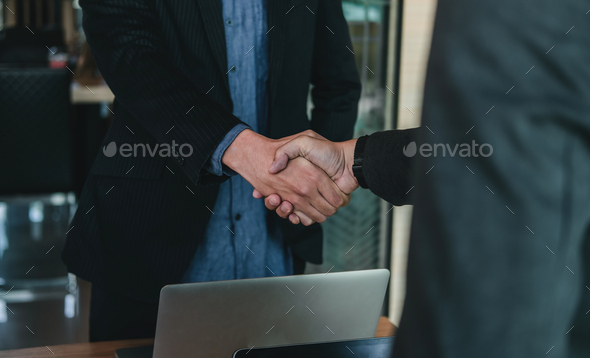 Businessman handshake for teamwork of business merger and acquisition,successful negotiate,hand - Stock Photo - Images