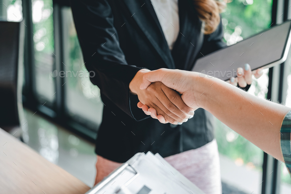 two businessman shake hands as hello in office closeup. Friend welcome, introduction, greet or