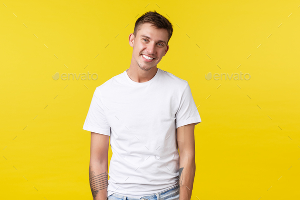Lifestyle, summer and people emotions concept. Handsome happy smiling gay man wearing basic white t