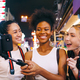 Groups of multi-ethnic female friends are enjoying a night out on Chinatown in Bangkok, Thailand. - PhotoDune Item for Sale