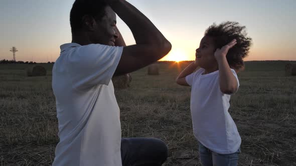 Happy Dad and Girl Giving Five and Hugging Outdoor alt