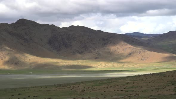 Asian Yurts in Green Plain Beside The Treeless Hill alt