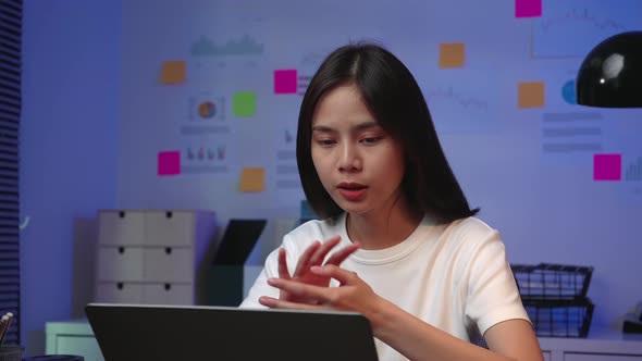 Woman look to laptop at video calling meeting and talking with friends online alt