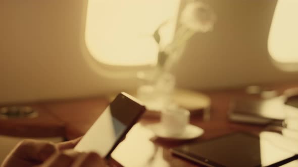 Businessman Analyzing Smartphone Financial Graphs alt