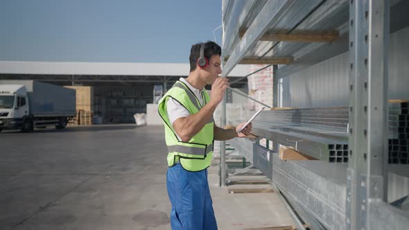 Joyful Middle Eastern Man in Uniform Dancing Spinning in Slow Motion Enjoying Music in Headphones alt