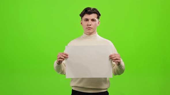 The Man is Standing and Looking at the Camera alt