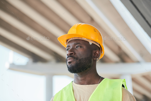 Dramatic portrait of modern construction worker