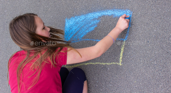Flag of Ukraine. Chalk drawing on sidewalk. Creative support by children for Ukraine.