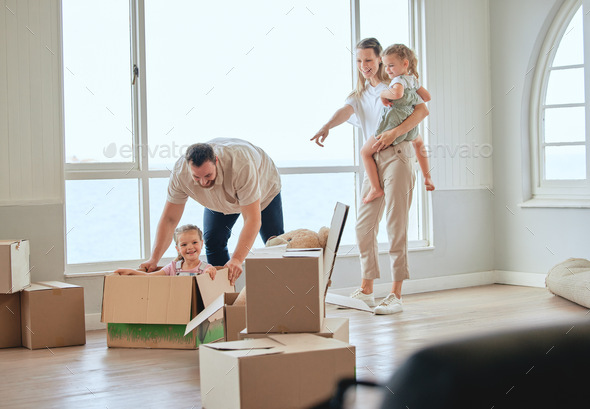 A new house to make loving memories in. Shot of a young family moving into their new home.