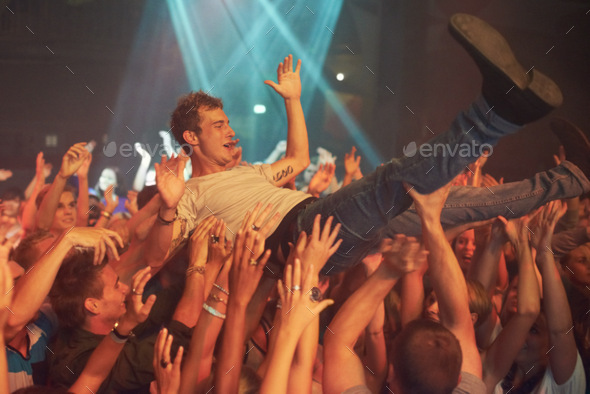 Wild music moves. Cropped shot of a man crowd surfing at a music festival.