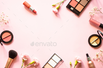 Makeup professional cosmetics on pink background.