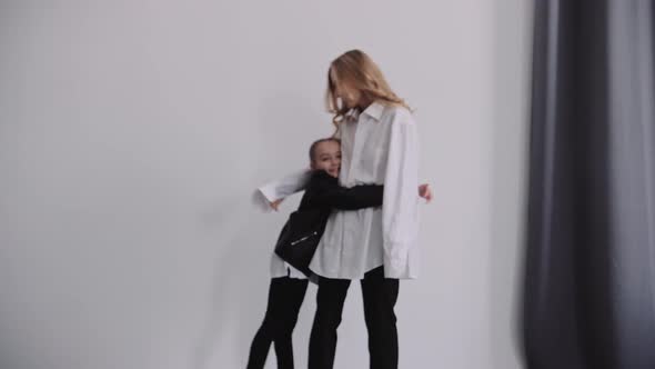 Beautiful Mother with Her Cute Daughter alt