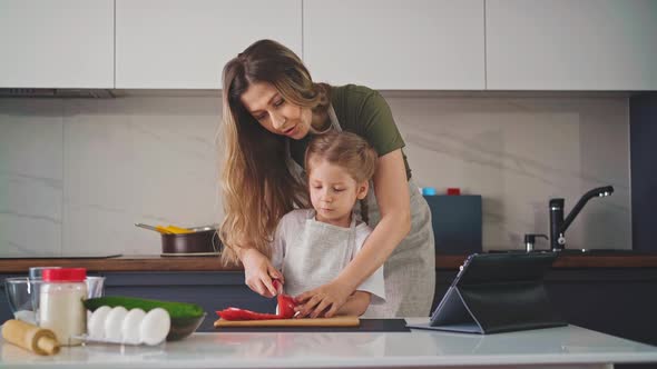 Mother Holds Her Daughter's Hand alt