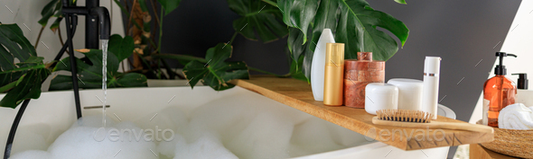 Wooden shelf for beauty and body care products on wooden shelf over modern white bubble filled