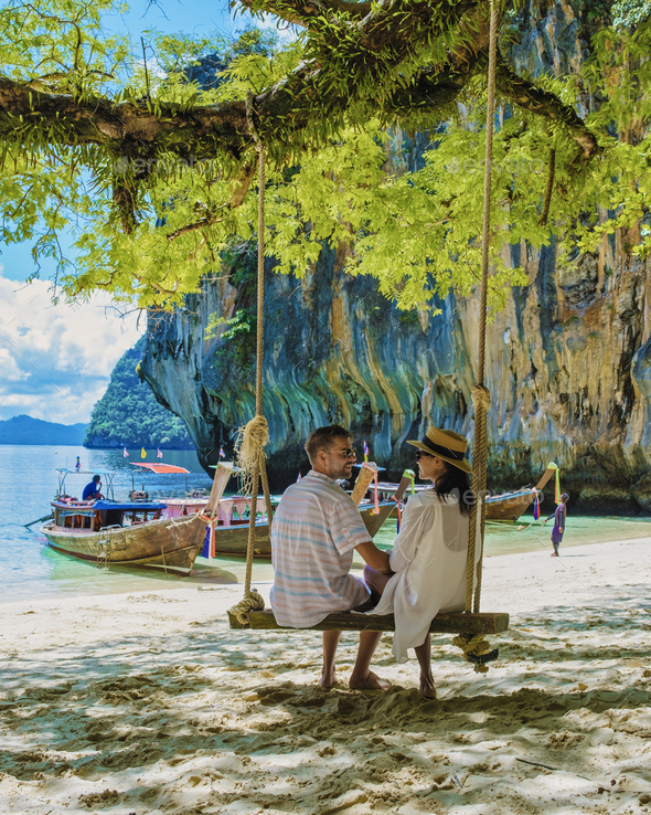 Koh Lao Lading near Koh Hong Krabi Thailand, beautiful beach with longtail boats, couple European - Stock Photo - Images