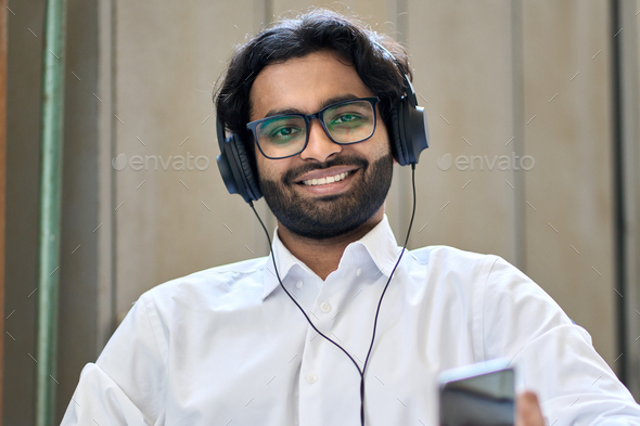 Happy indian business man having hybrid call virtual meeting. Screen view