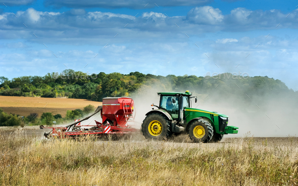 TERNOPIL REGION, UKRAINE - SEPTEMBER 14, 2019: apply fertilizer using tractor with a seeder