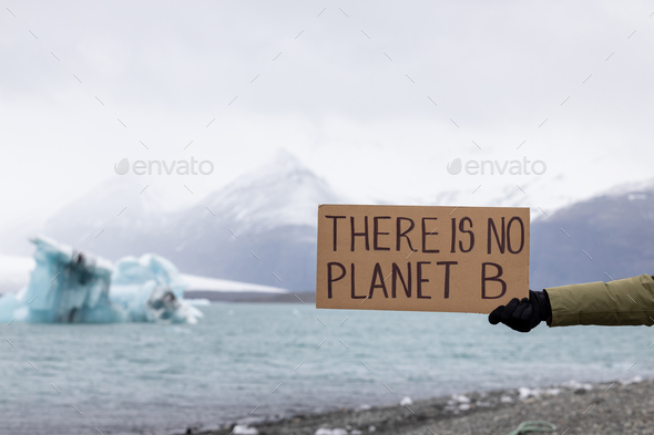 Activist holds a sign with an important message to humanity \