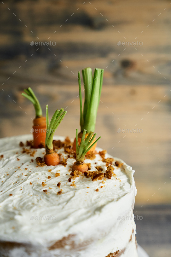 Fresh carrots as a decoration for a carrot cake. View from above