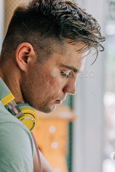 Portrait of a studen guy with headphones. Closeup