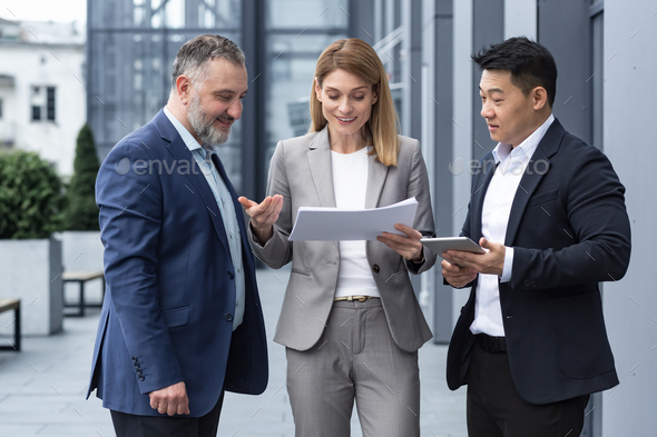 Diverse business group of three colleagues workers, upset and disappointed, result of financial - Stock Photo - Images