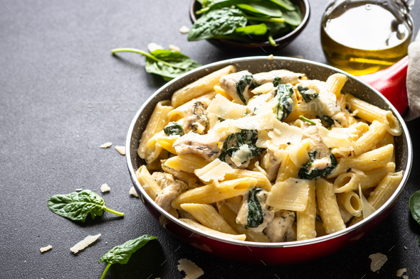 Pasta penne with chicken and spinach in creamy sauce. Stock Photo by ...