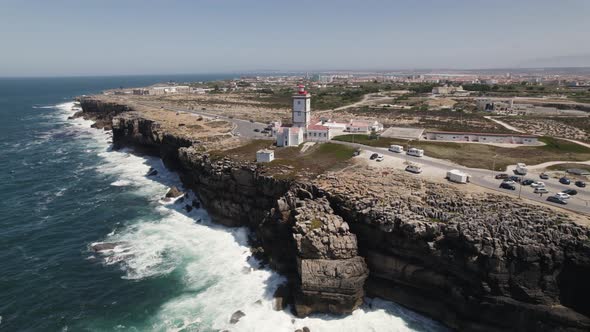 Aerial orbiting view Coastal lighthouse of Cabo Carvoeiro, Peniche - Portugal