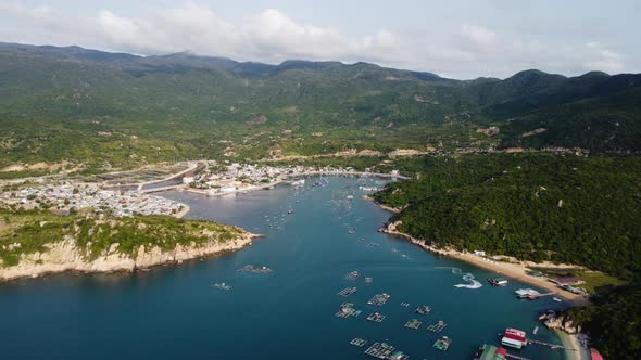 A breathtaking view over the waters of Vinh Hy bay in Vietnam. Countless boats moored near the sand alt