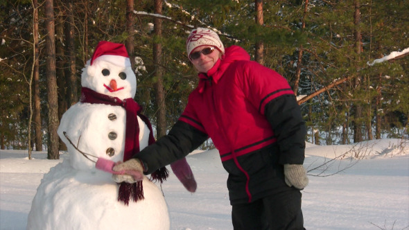 Woman Poses With Snowman