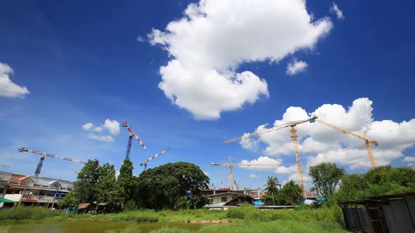 4k Time-lapse of Industrial construction crane with the blue sky background alt