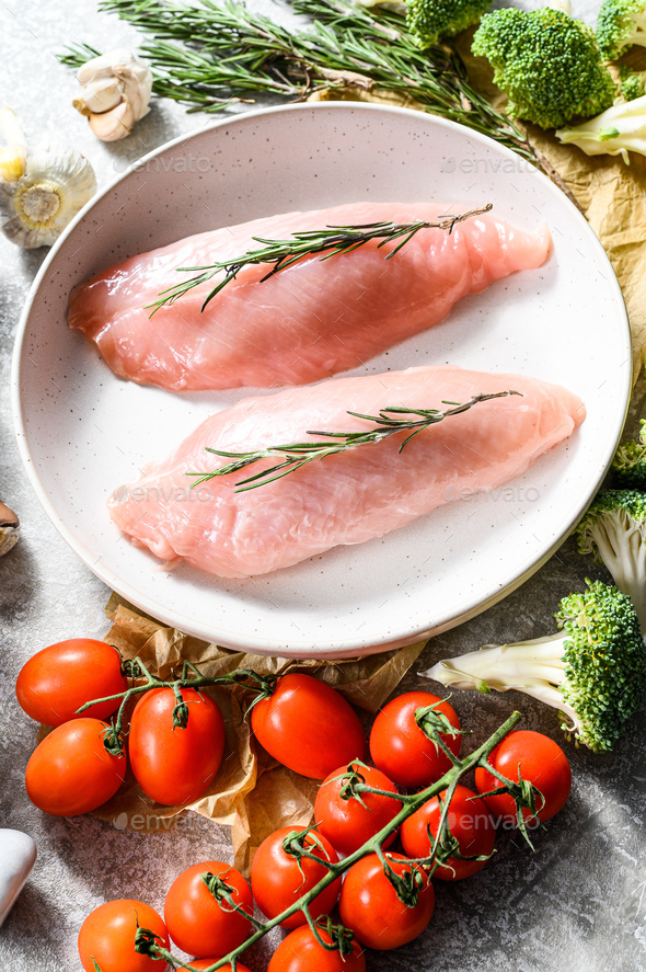 Turkey fillet. Farm poultry breast meat. Gray background. Top view