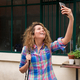 happy woman holding mobile phone taking selfie - PhotoDune Item for Sale