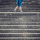 Legs of a woman walking between concrete stairs - PhotoDune Item for Sale