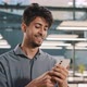 Smiling Arabian Male Professional Manager Entrepreneur Supervisor Business Man Holding Smartphone