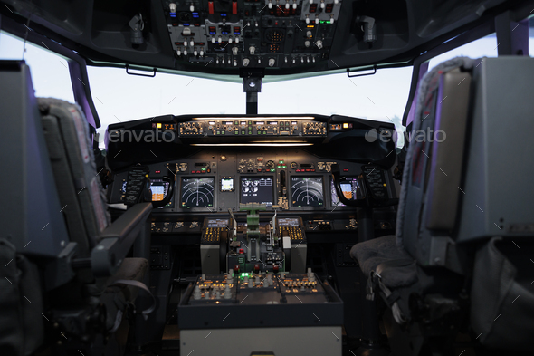Nobody in airplane cabin with dashboard command and control panel
