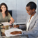 African businesswoman signing document during meeting - PhotoDune Item for Sale