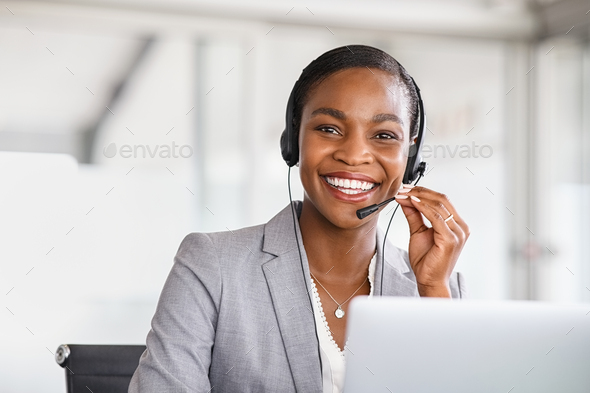 Portrait of customer service woman working on call center - Stock Photo - Images