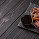 Homemade churros with chocolate on a dark wooden rustic background. - PhotoDune Item for Sale