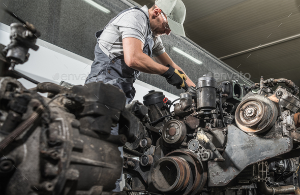 Truck Mechanic Rebuilding Truck Diesel Engine
