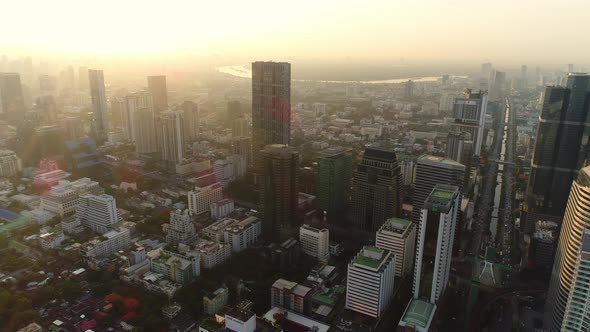 4k Aerial city view of Bangkok dowtnown, Flying over Bangkok, Thailand. alt