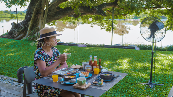 Luxury Asian breakfast on a table by the River Kwai in Thailand