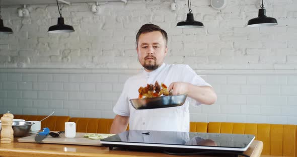 Chef Frying Food on Pan Tossing Throw Up Ingredients