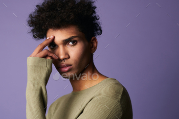 Close up portrait of african american model looks camera. Attractive male with afro hairstyle