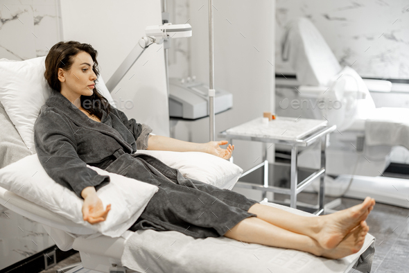 Woman during medical procedure at medical spa salon